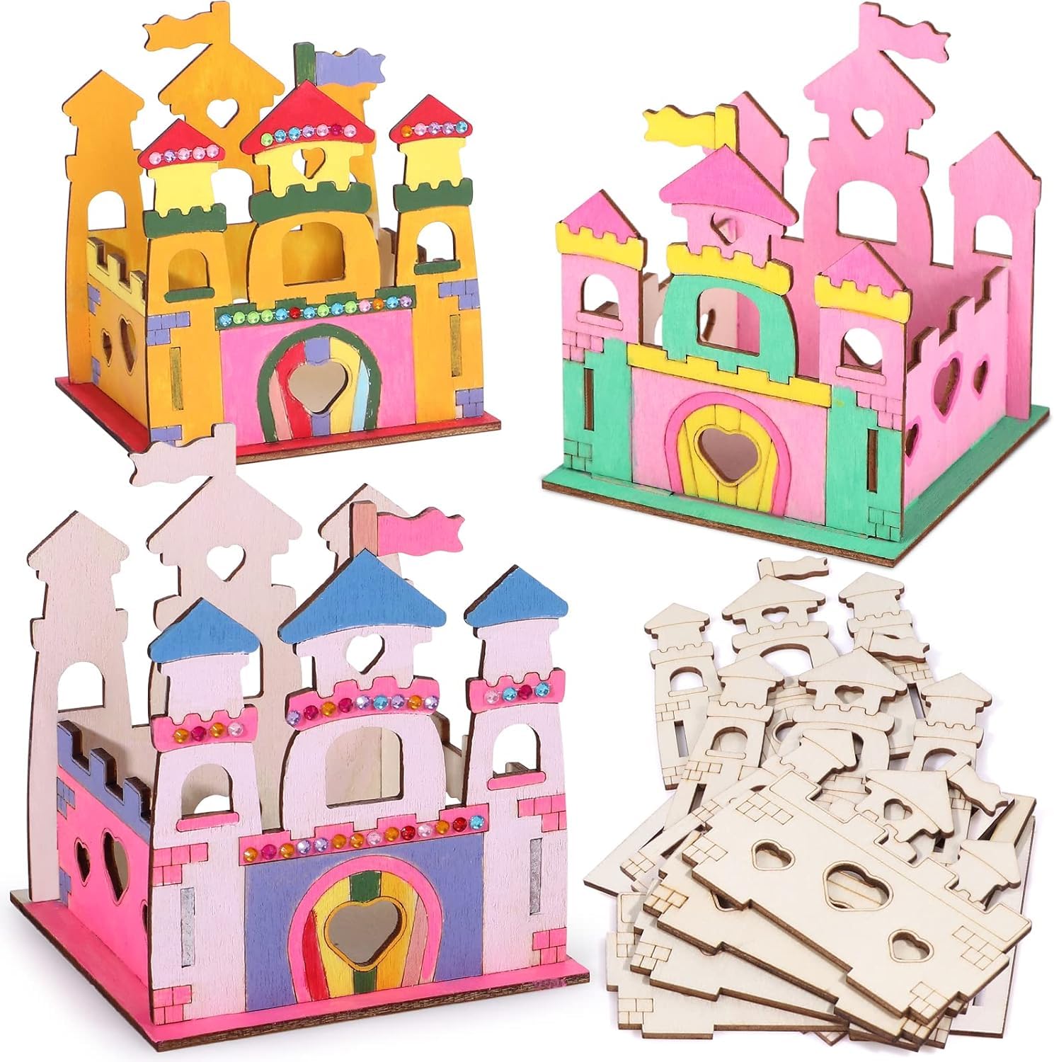 Colorful cardboard castle models with building pieces on a white background