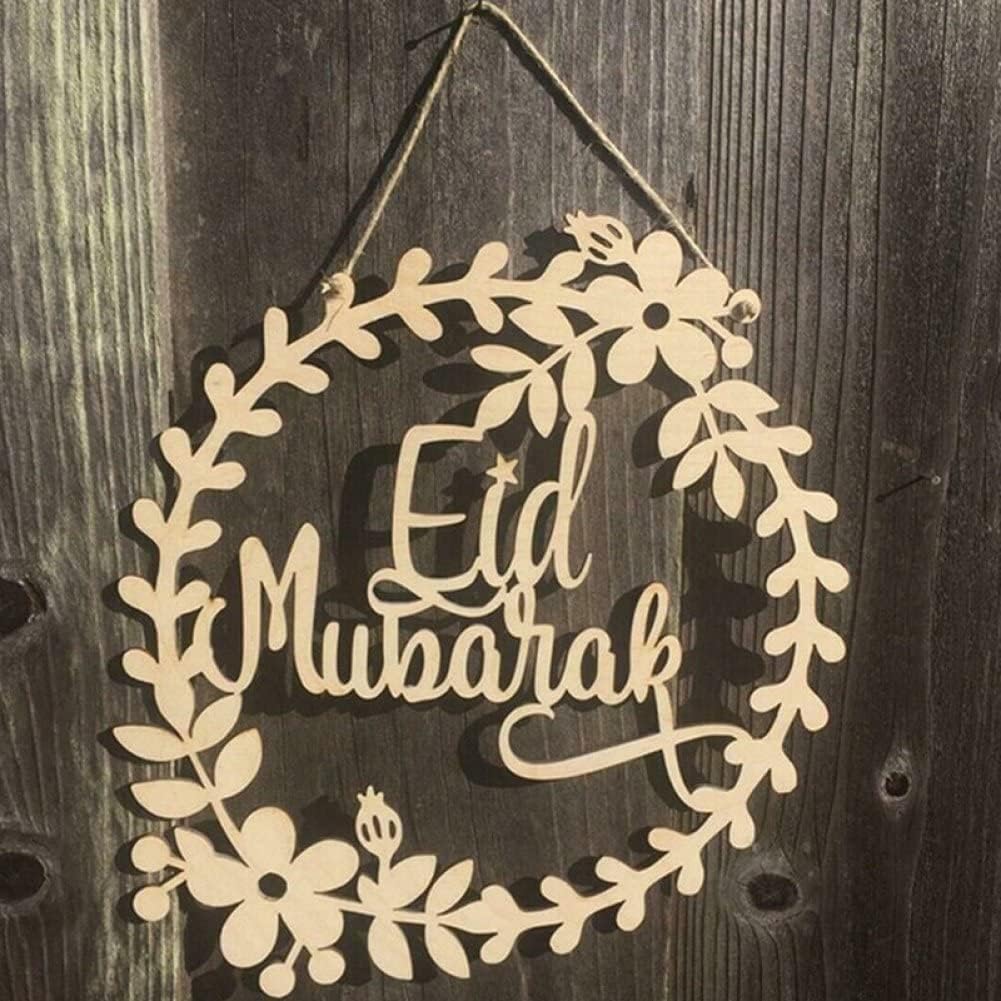 Decorative sign with 'Eid Mubarak' text on a wooden background