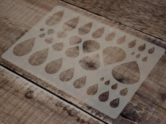 Wooden cutting board with a leaf pattern on a wooden surface