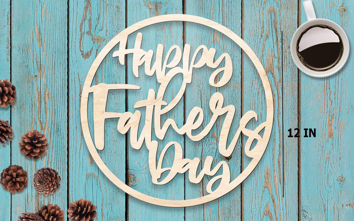 Wooden 'Happy Father's Day' sign on a wooden surface with pinecones and a coffee cup.