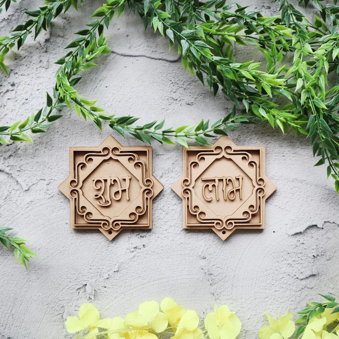 Two wooden decorative items with engraved text on a light gray surface with green leaves and yellow flowers.