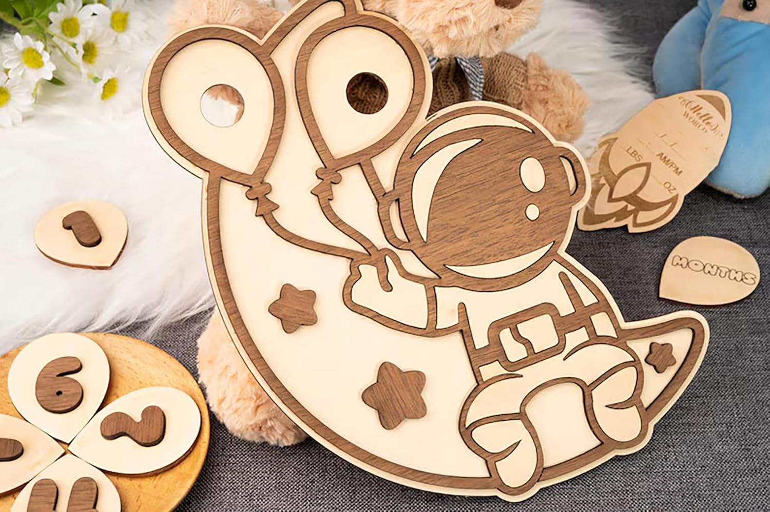 Wooden toy mouse with attached numbers on a textured surface with flowers and another toy in the background.