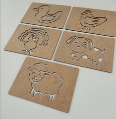 Five cardboard stencils with animal cutouts on a white background