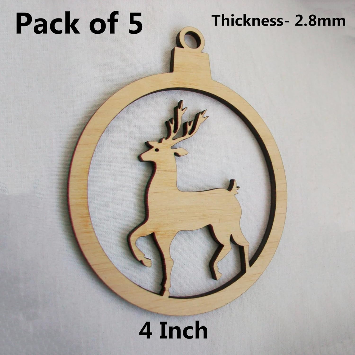 Wooden ornament with deer design on a plain background