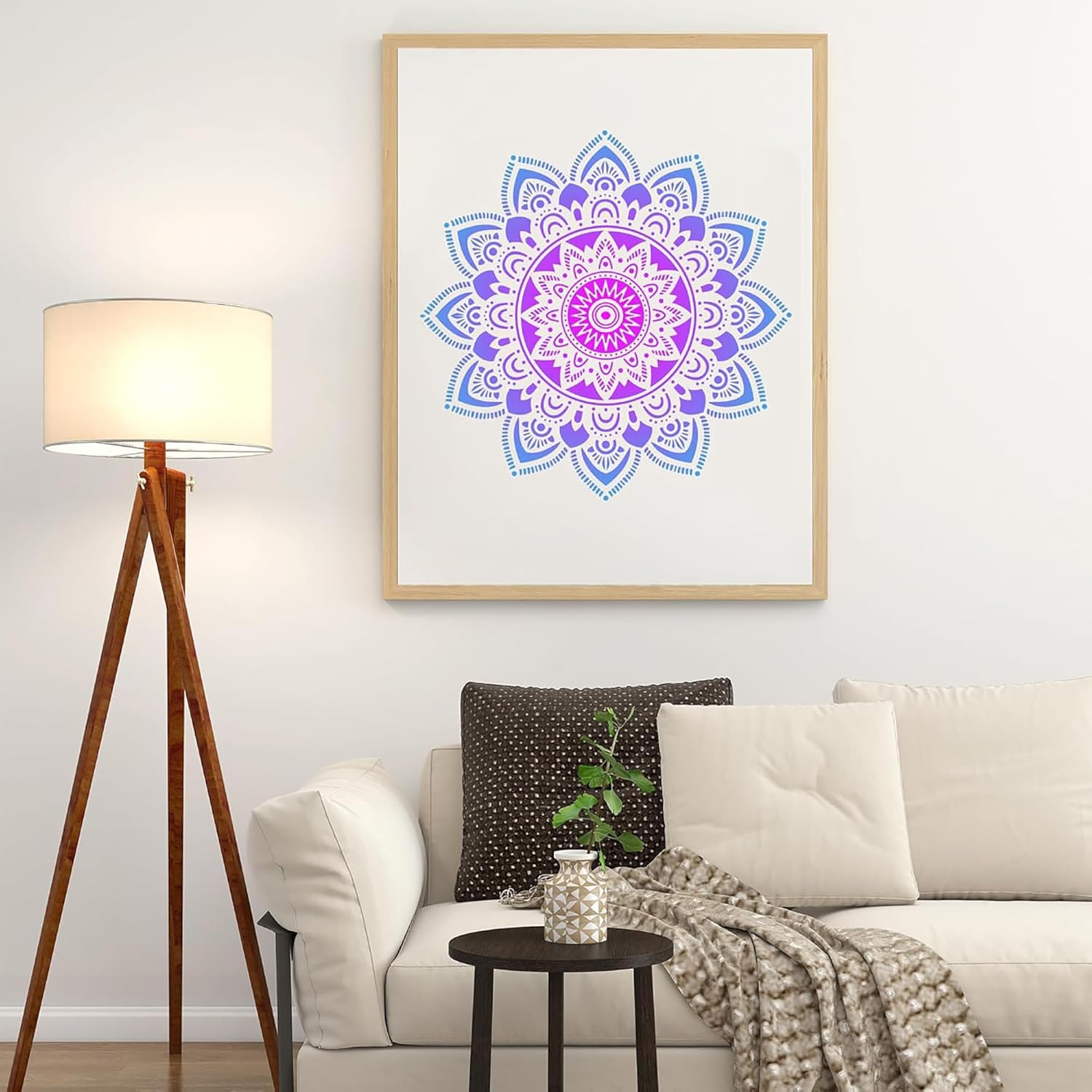 Living room with a framed mandala art piece on the wall, a lamp, and a couch.