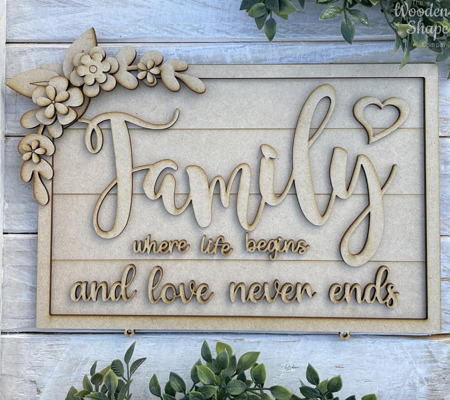Wooden decorative sign with 'Family where life begins and love never ends' text on a wooden background.