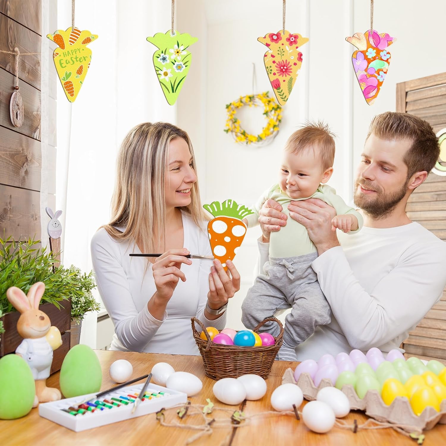 Family engaging in Easter egg decorating activity with colorful decorations and eggs.