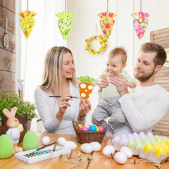 Family engaging in Easter egg decorating activity with colorful decorations and eggs.