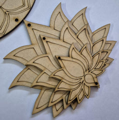 Wooden laser-cut decorative piece with intricate patterns on a light gray background
