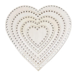 Set of heart-shaped white templates with holes on a white background