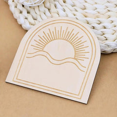Card with sun design on a woven mat background
