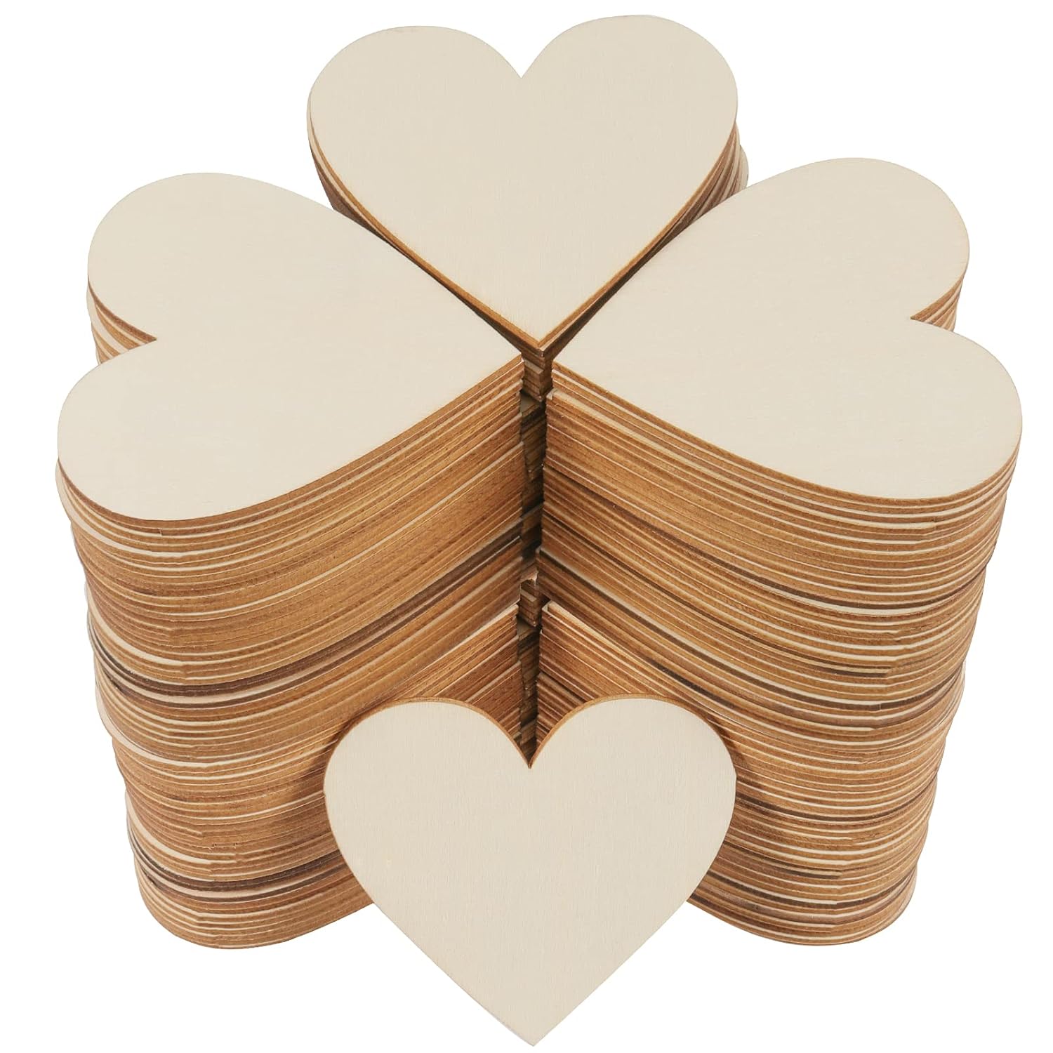 Stack of wooden heart shapes on a white background