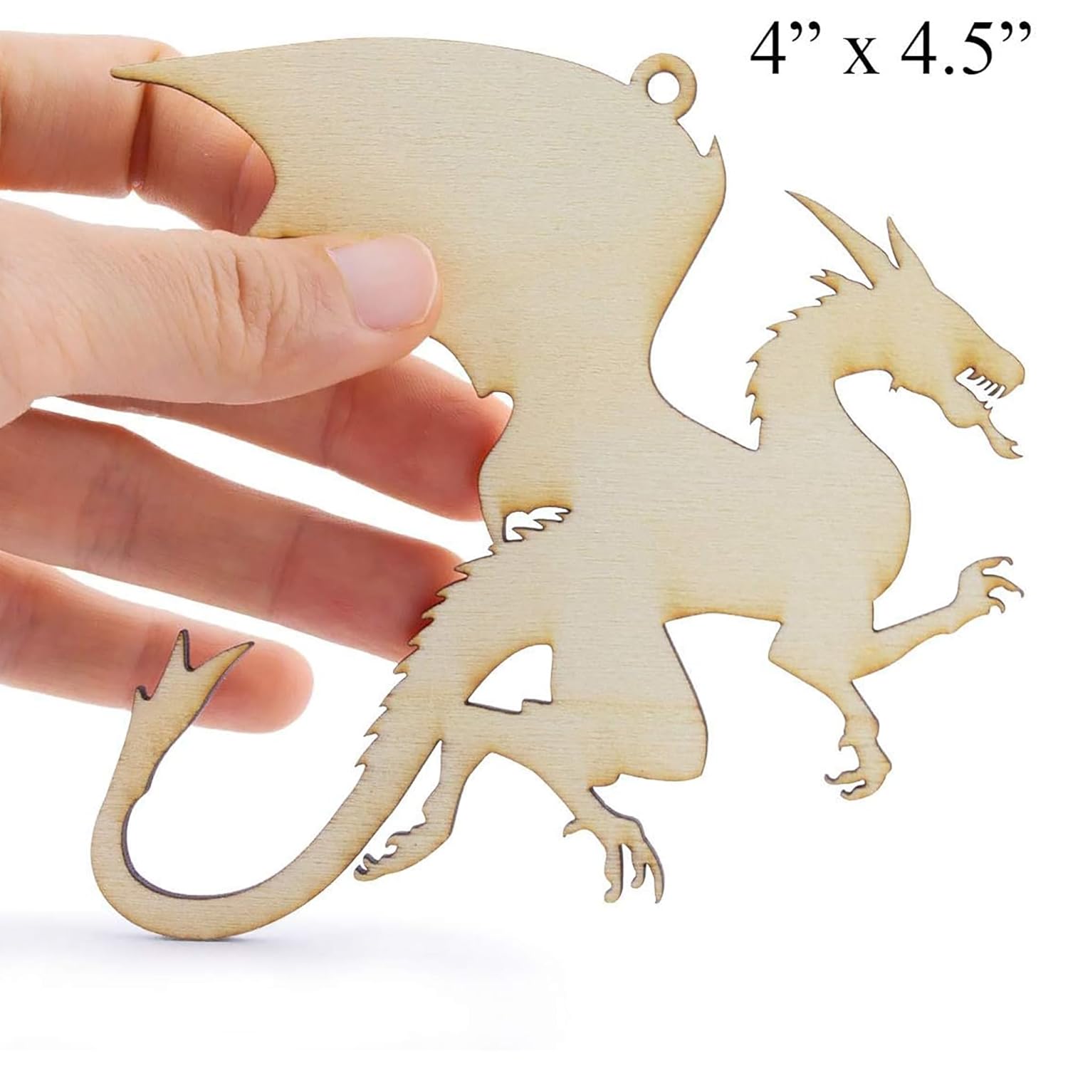 Wooden dragon ornament held by a hand with dimensions displayed.