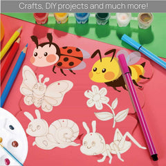 Colorful craft materials with cartoon insects and flowers on a pink surface.
