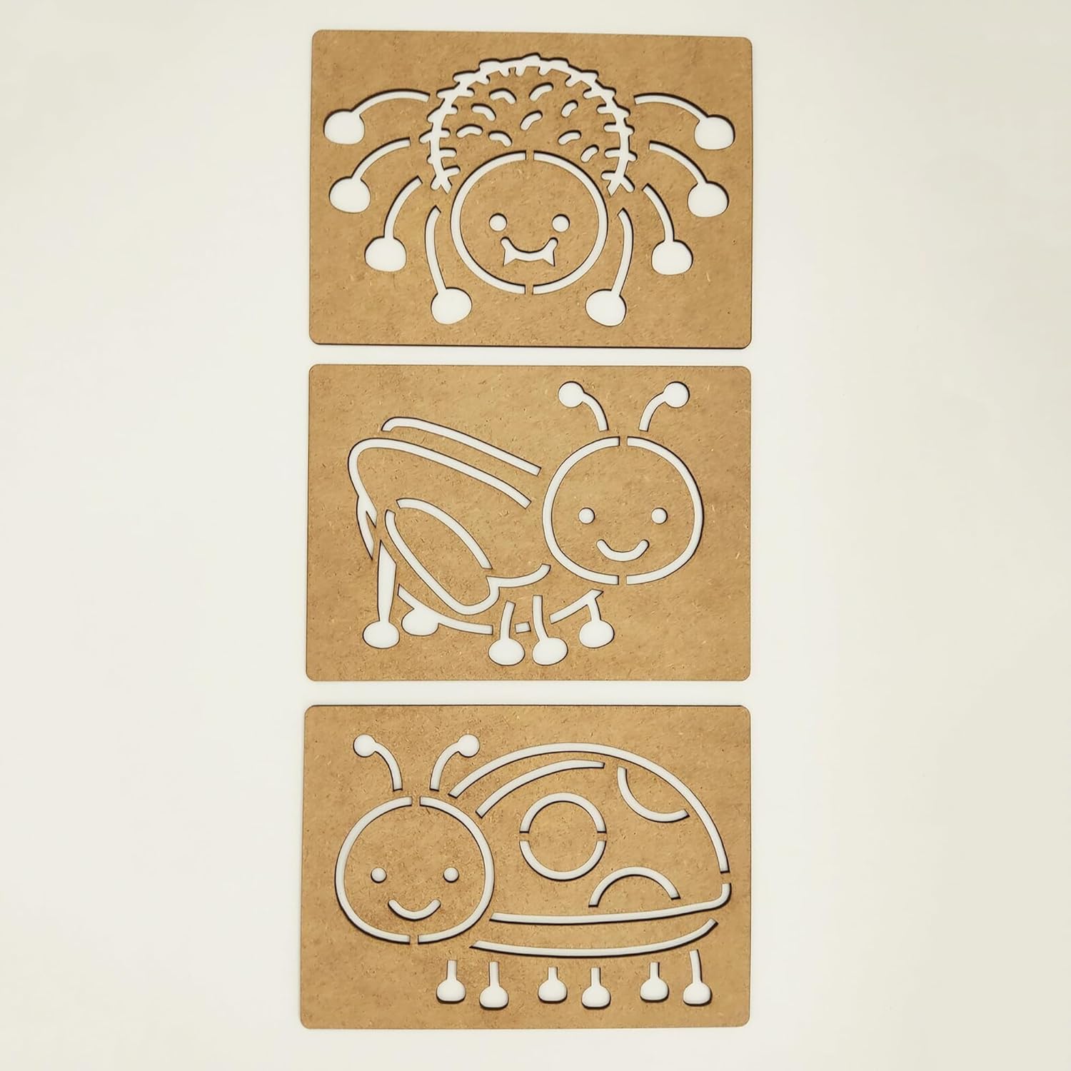Three cardboard cutouts of animals on a beige background