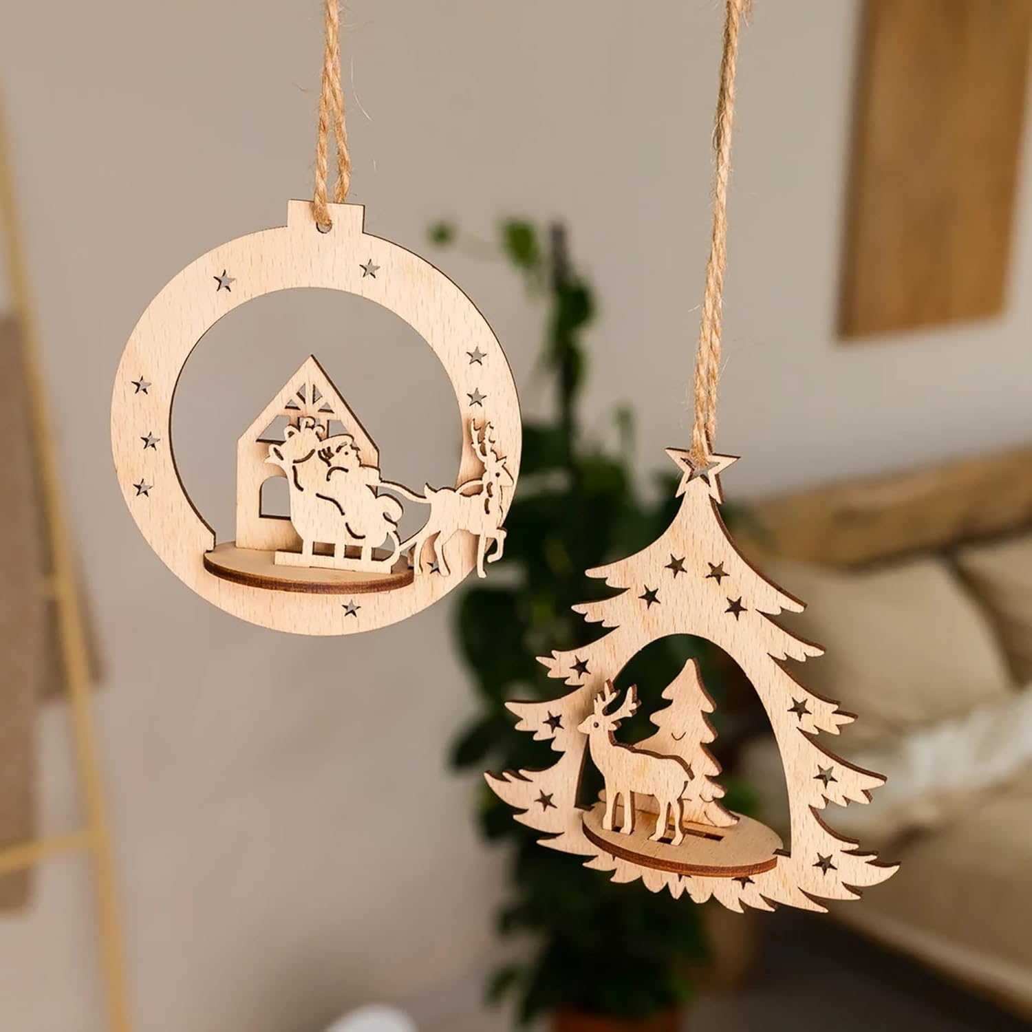 Two wooden Christmas ornaments hanging against a blurred indoor background