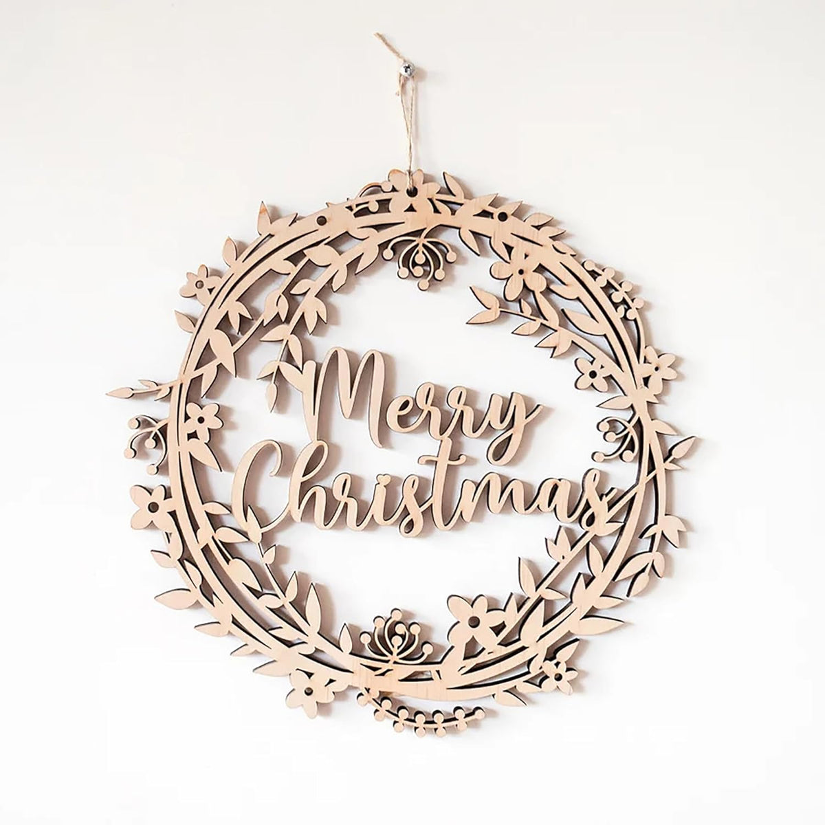 Wooden wreath with 'Merry Christmas' text on a white background