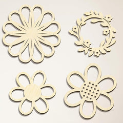 Four wooden floral cutouts on a beige background