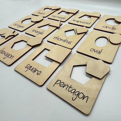 Set of wooden shape cutouts with labels on a white background