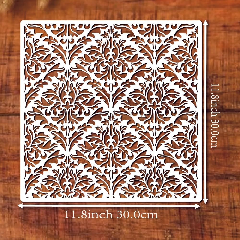 Decorative metal screen with intricate floral pattern on a wooden background