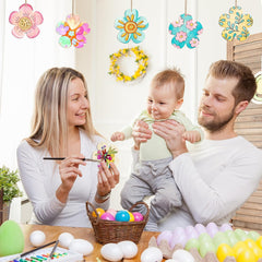 Family of three engaging in Easter egg decorating activity with colorful eggs and decorations.