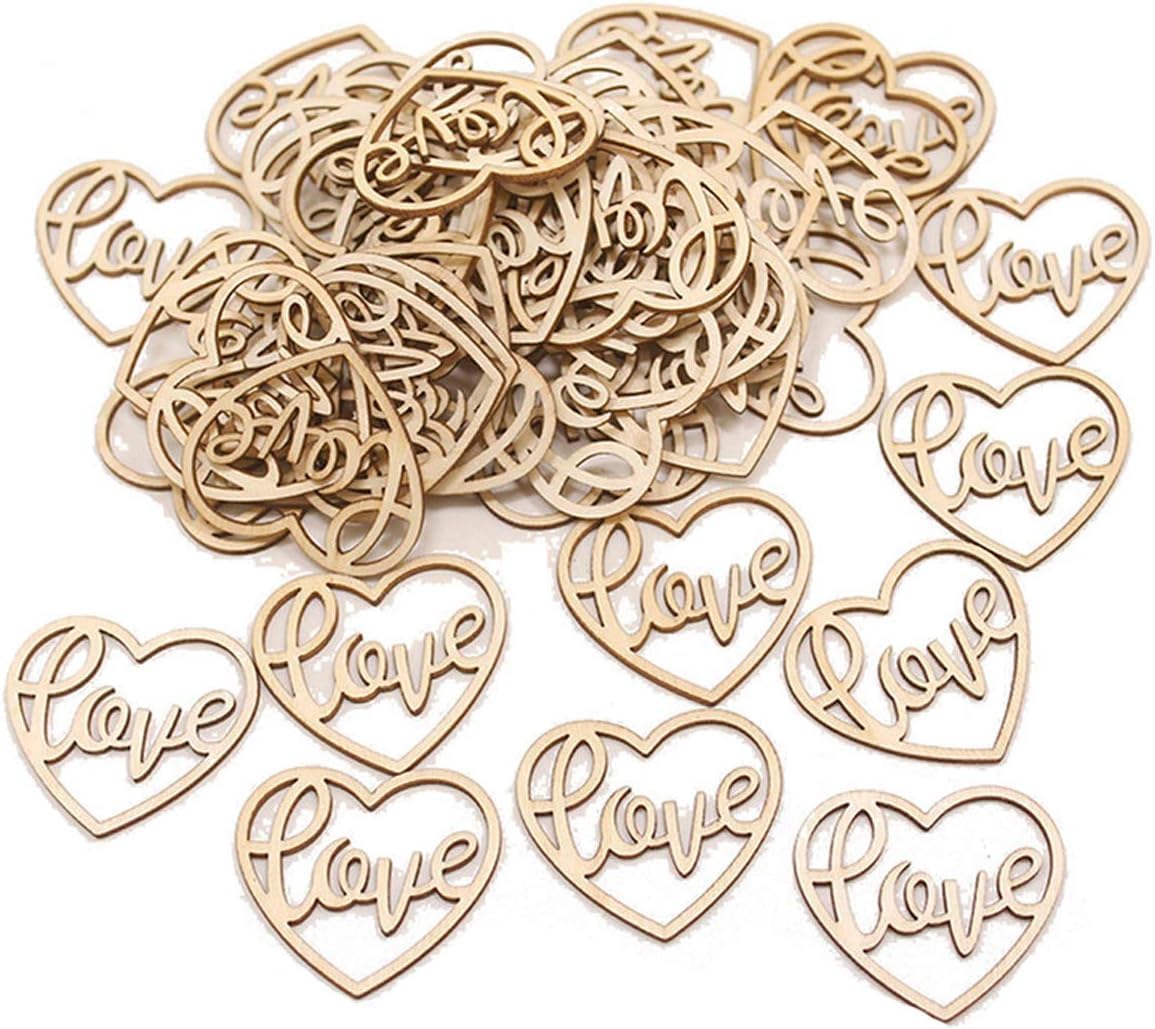 Wooden heart-shaped cutouts with 'love' engraving on a white background