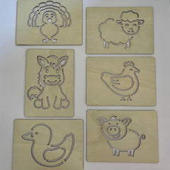 Set of six wooden animal stamps on a white background