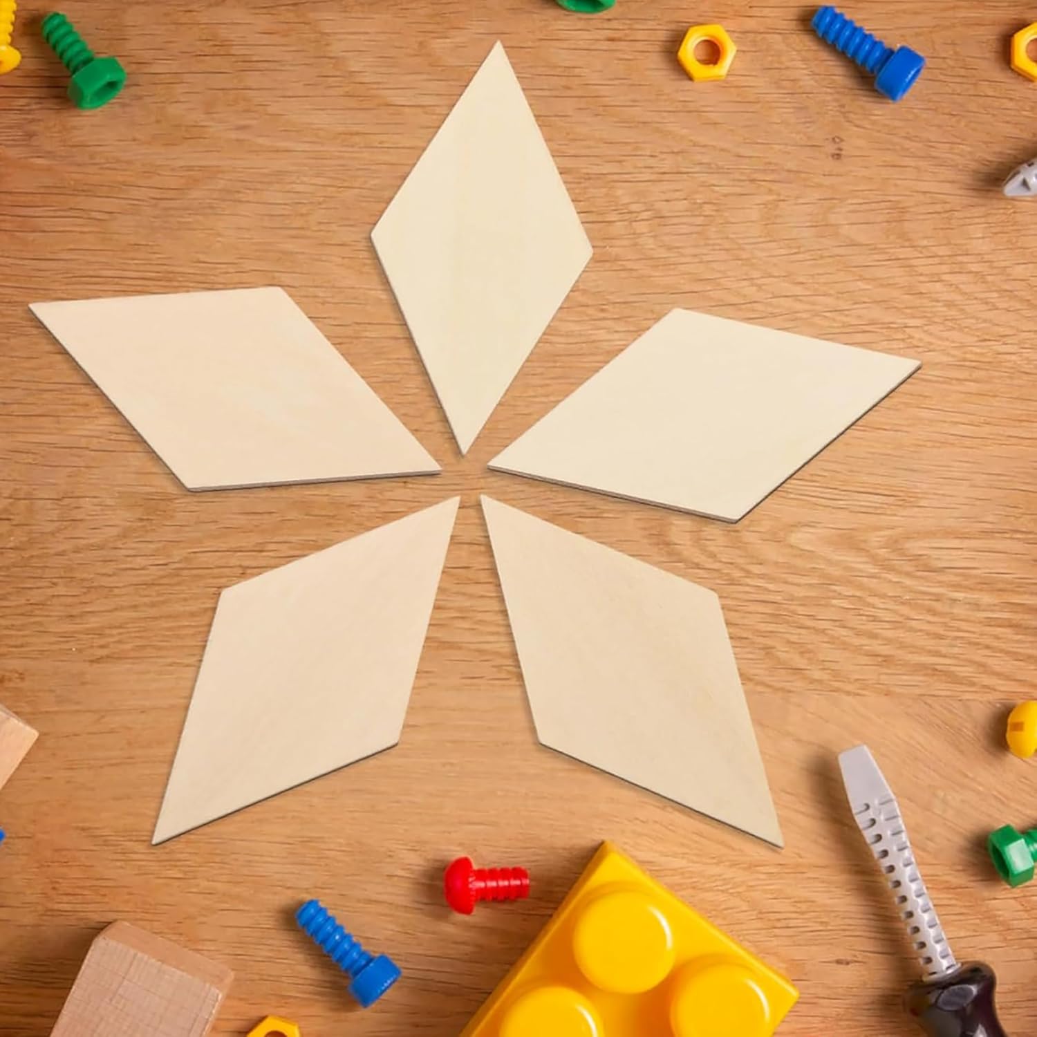 Geometric shapes on a wooden surface with colorful toys around