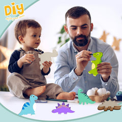 Man and child playing with dinosaur toys on a table.