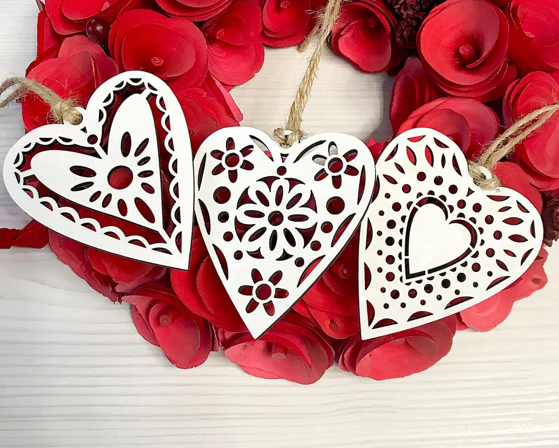 Decorative heart-shaped ornaments on a red floral background