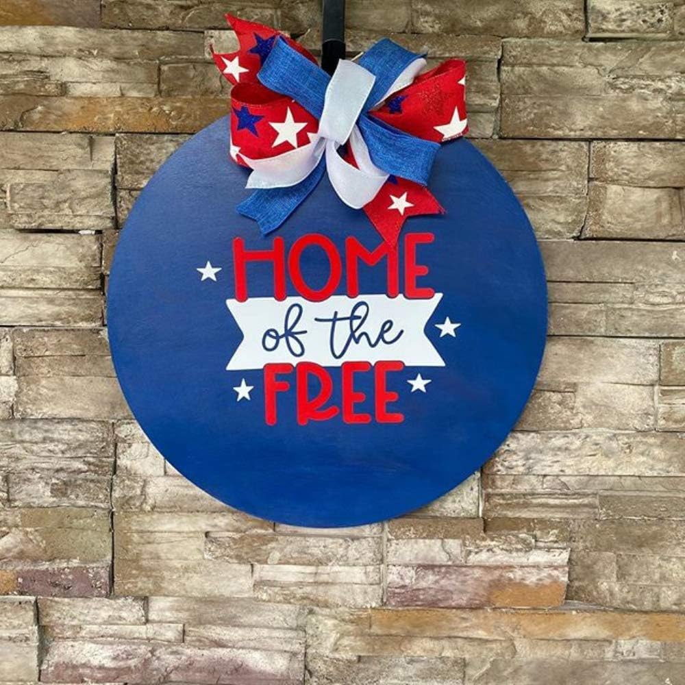 Decorative sign with 'Home of the Free' text and a large bow on a stone wall background