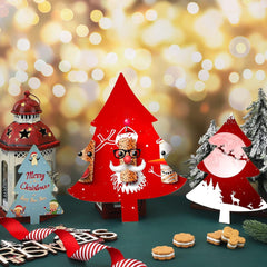 Christmas-themed decorations including a red tree-shaped figure, Santa Claus figure, and festive trees on a blurred background.