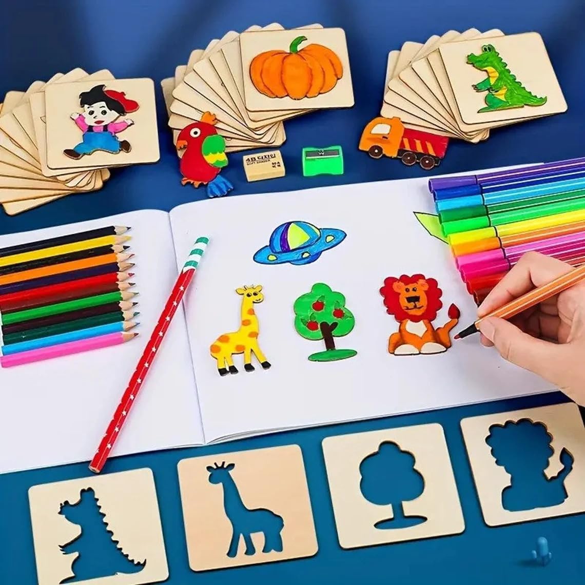 Coloring book with animal illustrations, coloring pencils, and wooden stencils on a blue background