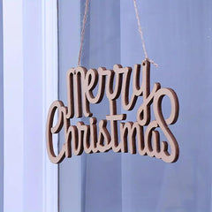 Wooden 'Merry Christmas' decoration hanging against a light blue curtain.