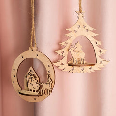Two wooden Christmas tree ornaments on a pink background