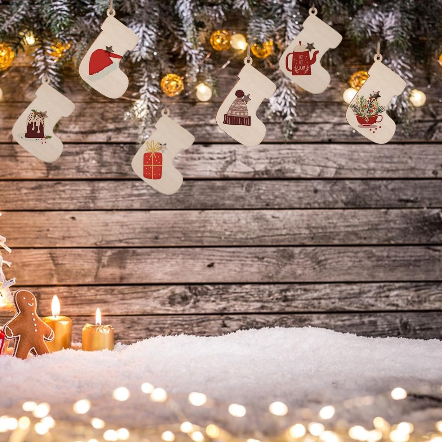 Decorative Christmas stockings with festive illustrations on a wooden background with snow and lights.