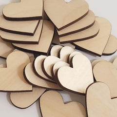 Stack of wooden heart shapes on a white background