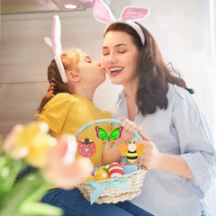 Woman and child wearing bunny ears with an Easter basket filled with eggs and toys.