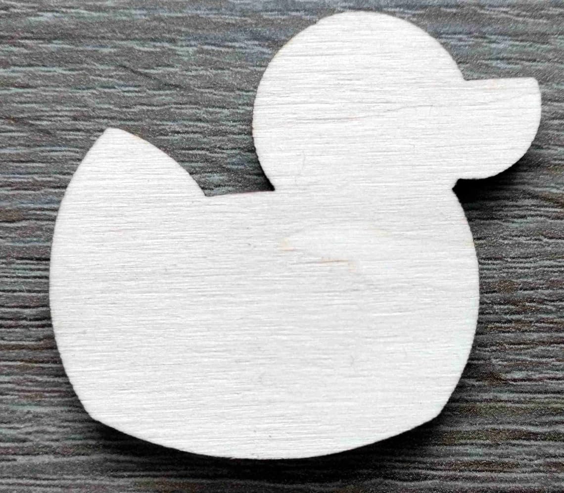 White rubber duck toy on a wooden surface