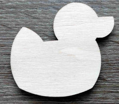 White rubber duck toy on a wooden surface