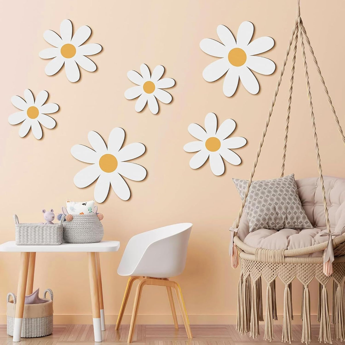 Children's room with daisy wall decals, a swing chair, and small table.
