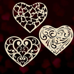 Three ornate heart shapes on a dark background