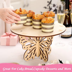 Wooden cake stand with cupcakes on a table with drinks and gifts in the background