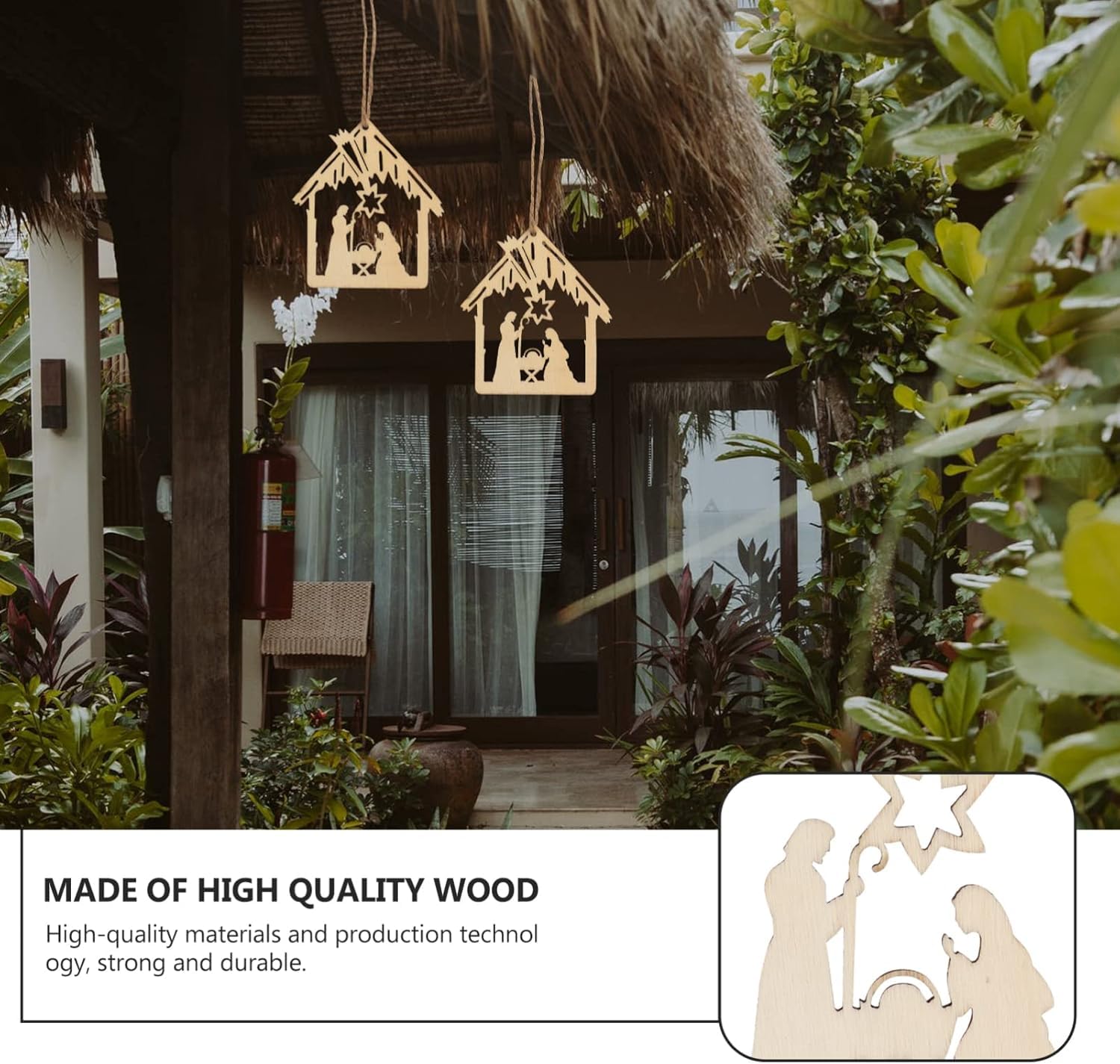 Decorative nativity scene hanging outside a thatched-roof building with plants.