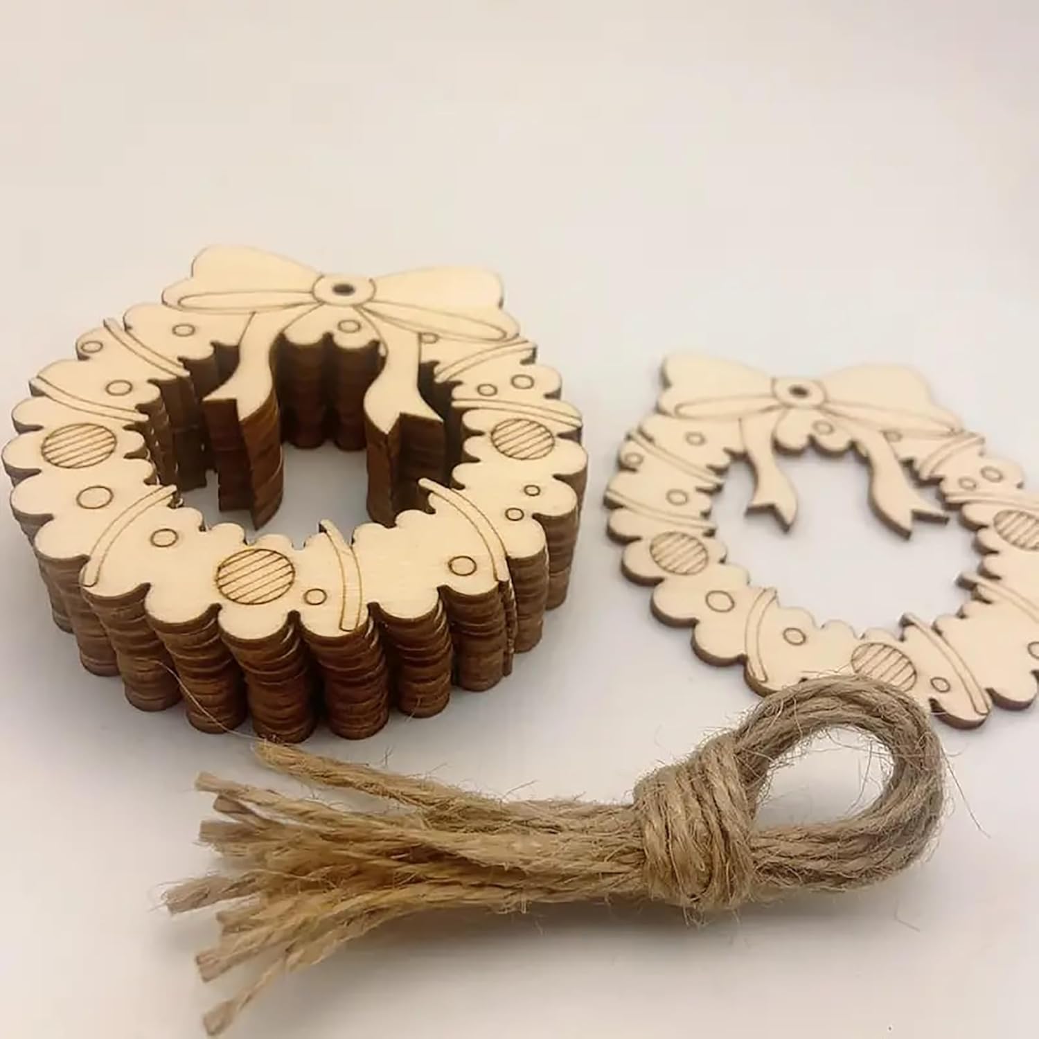Wooden wreath decorations with a tassel on a white background
