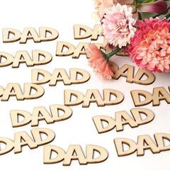 Wooden 'DAD' letters with pink flowers on a white background