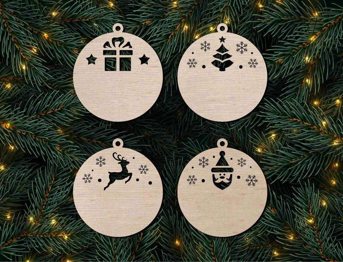 Four wooden Christmas ornaments with festive designs on a green branch background.