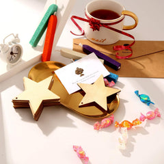 Decorative items including a mug with a bow, star-shaped objects, and candies on a white surface.