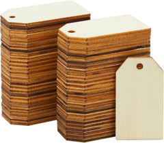 Stacks of wooden tags with a plain background
