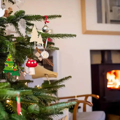 Decorated Christmas tree with ornaments in a living room with a fireplace.